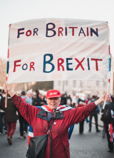 Woman holding up Pro-Brexit Sign